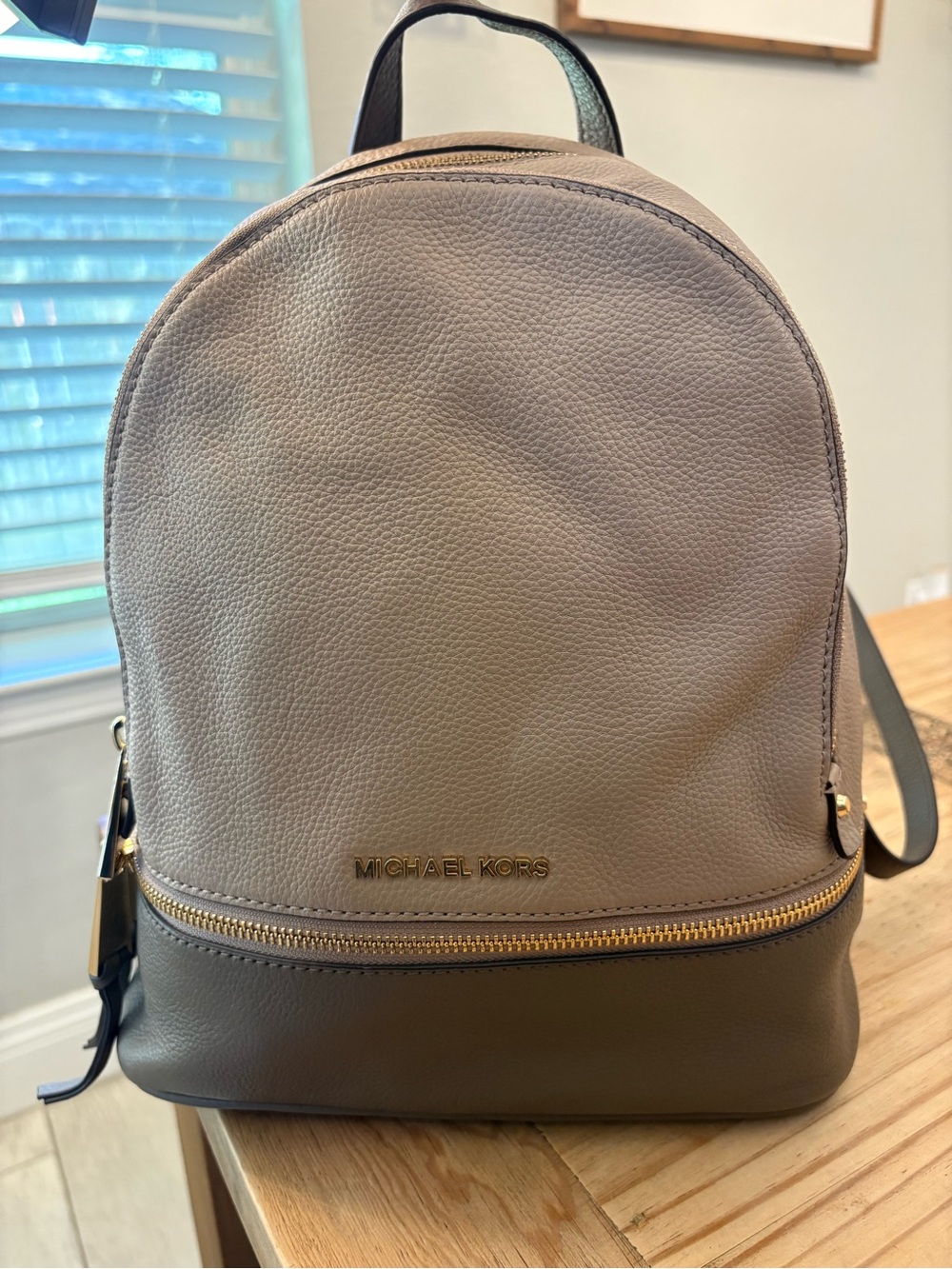 Michael Kors taupe and gold leather backpack